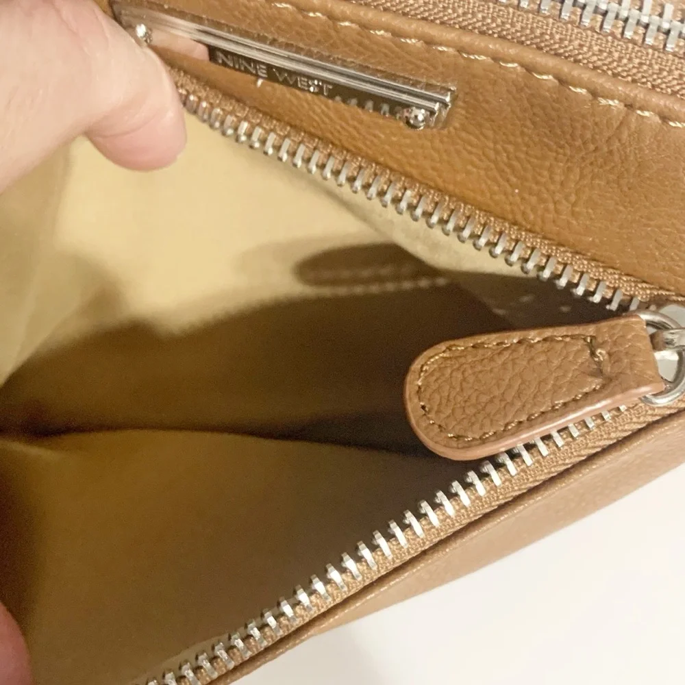 Nine West Faux Leather Wristlet Fully Line in Tan Print Studded Logo Plate Brown